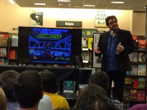 Ernest Cline speaking. The screen behind him says "Fan Boys"